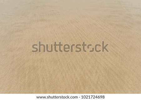 Tides create beautiful tracery on the beach.It is similar to the pattern of the cloth.