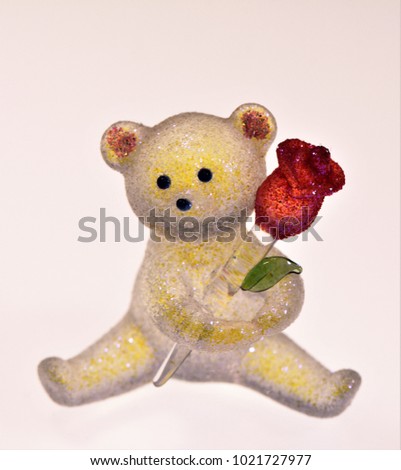 Romantic bear holding a flower
