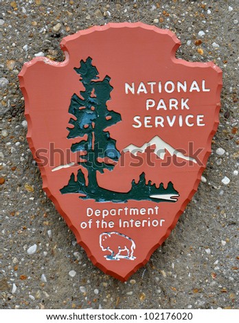 US national park service sign on the rock background Royalty-Free Stock Photo #102176020