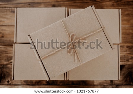 Craft giftbox and box package box presented on stressed brushed wooden table