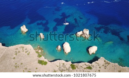 Aerial birds eye view photo taken by drone depicting beautiful deep blue turquoise waters and lovely rocky seascape in Glaronisi islet, Koufonisi island, small Cyclades, Greece