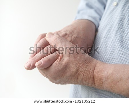 a man with painful joints on his hands