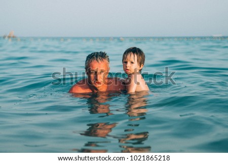 Family having fun in sea on summer vacation. Lifestyle, holiday. outdoor adventure and travel. Happy family.