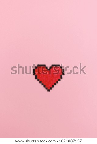 Red pixel heart on pink background - love concept for online dating or valentines day