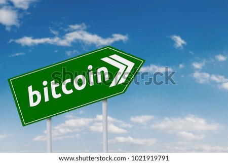 Picture of a green sign with bitcoin word under blue sky