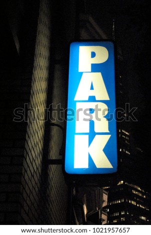 Parking signage on a parking garage in a city