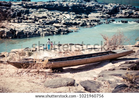 old wooden boat near river