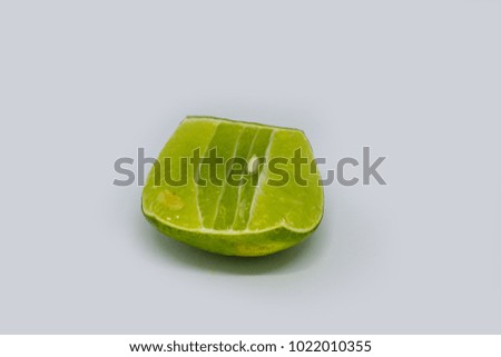 Green lime fruit isolated on white background