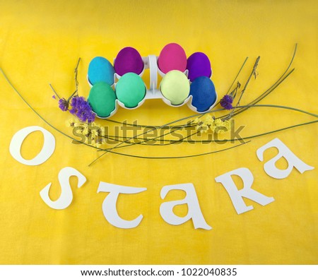 Picture for Ostara celebration. Colorful eggs and flowers.