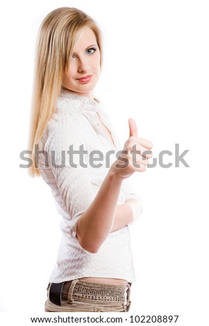 Half length portrait of a confident young blond woman showing thumbs up.