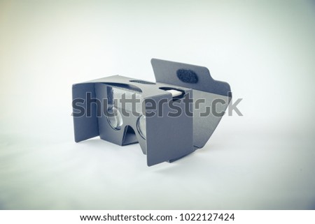 Gray virtual reality headset isolated on white. Vintage look.