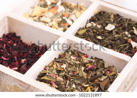 Four kinds of tea in the box are a top view. Isolated.