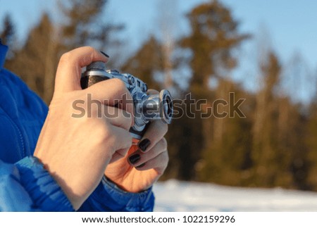 Old camera in hands, photography concept