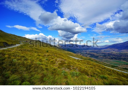 A peaceful breathtaking scenery of a natures way with a blue clear sky of a country.