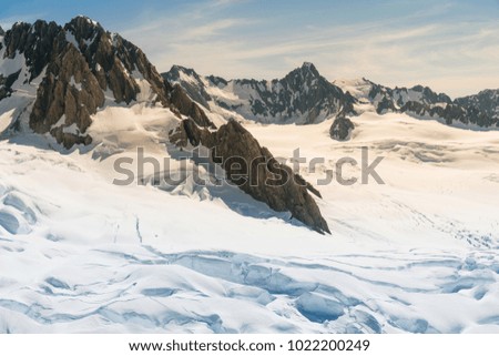 Fox glacier with Tasman mountain, with snow covered, New Zealand natural landscape background