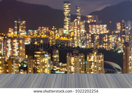 City light night view blurred bokeh, opening wooden floor, abstract background