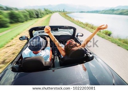 Couple in love ride in cabriolet car Royalty-Free Stock Photo #1022203081