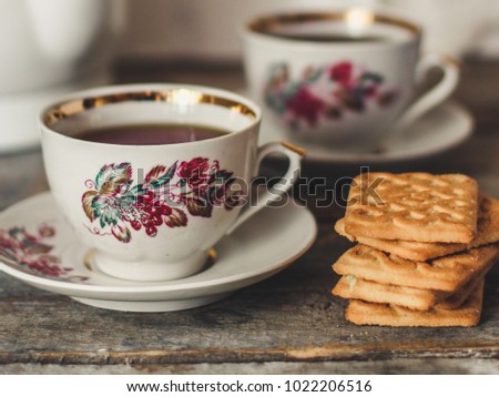 tea-drinking with cookies - on a wooden table
