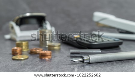 Money and Office accessories on a desk