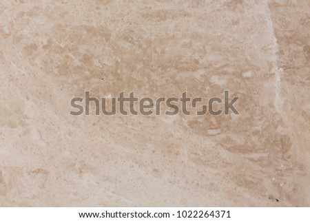 Beige stone background, close up. High resolution photo.