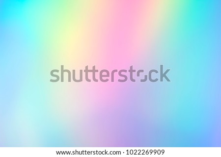Blurry abstract iridescent holographic foil background Royalty-Free Stock Photo #1022269909