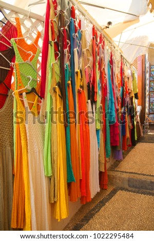 Colorful knitted dresses at the market