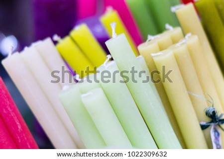 Candles background. Multicolored candles. Aroma candles.