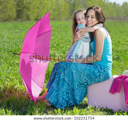 Happy mother and daughter outdoors