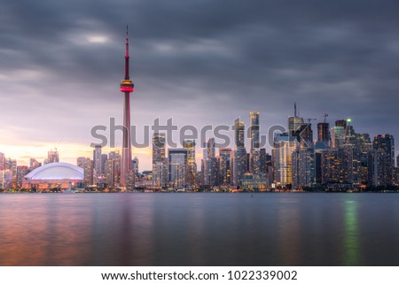 Sunset over modern buildings in Toronto city skyline in Ontario, Canada