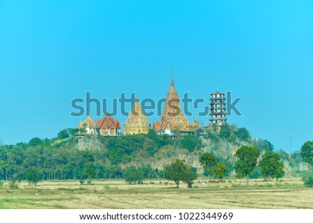 Summer Landscape with temple ,green field and blue sky in the middle of the Temple is a beautiful picture, Copy space for text