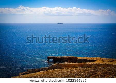View of maltese coast from the Mnajdra temple complex and in the distance Filfla island.