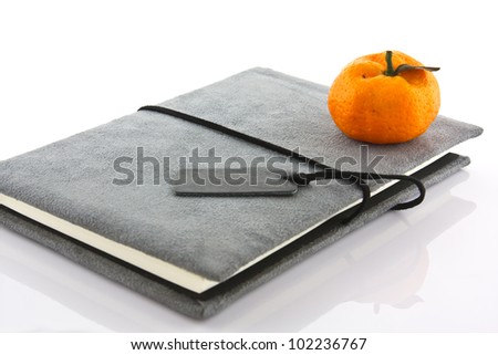 diary book and orange