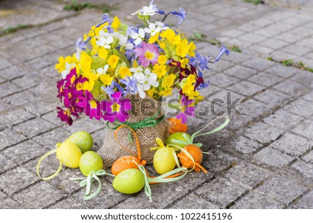 Easter Eggs and Spring Flowers in Vase