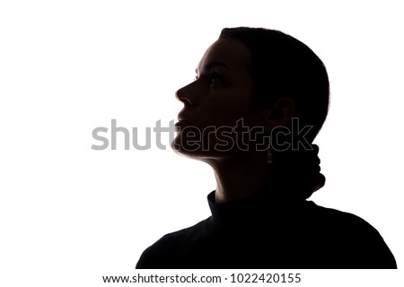 Portrait of a young woman looking up, side view - horizontal silhouette Royalty-Free Stock Photo #1022420155