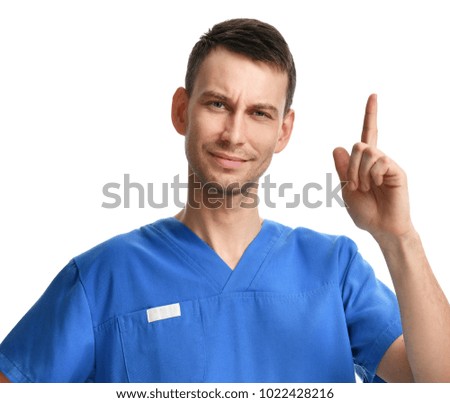 Portrait of smiling doctor dentist recommending the new way of treatment by showing one finger up sign isolated on white background