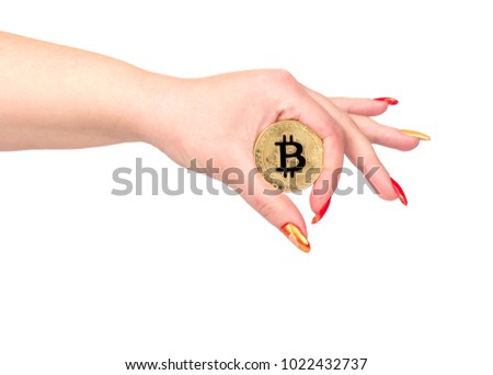 Gold bitcoin coin in female hand on white background