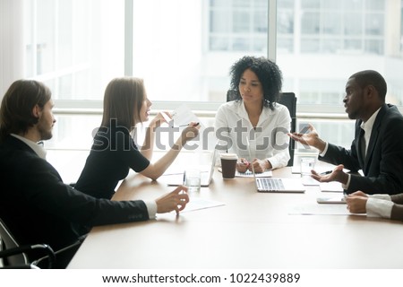 Diverse business partners arguing about bad contract at meeting in lawyers office, disgruntled clients disputing about scam fraud in law firm, cheated investors having claims dissatisfied with loan Royalty-Free Stock Photo #1022439889