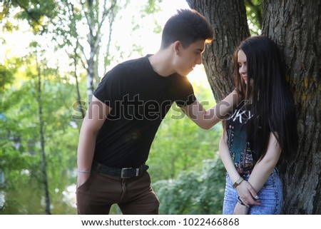 Young couple on the first date in the city park