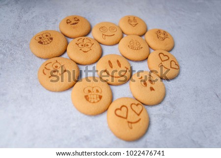 round cookies with different emotions, faces with emotions
