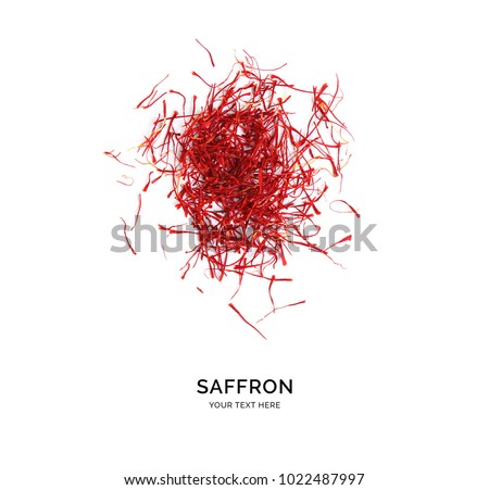 Creative layout made of saffron on white background. Flat lay. Food concept. Royalty-Free Stock Photo #1022487997