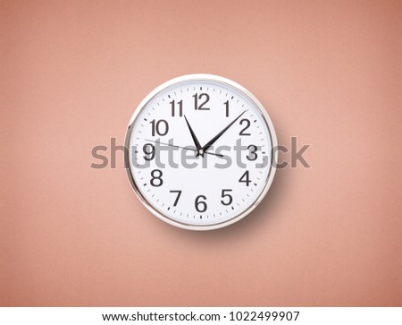 Time punctual second minute hour. Large clock on a blue wall. The concept of time.