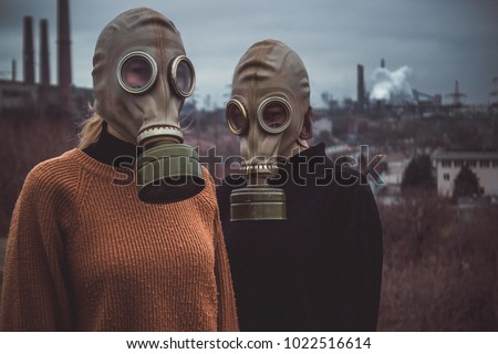 people wearing gas masks Royalty-Free Stock Photo #1022516614
