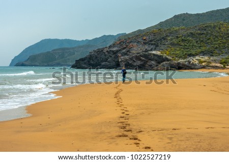 Girl walking by Calblanque beach