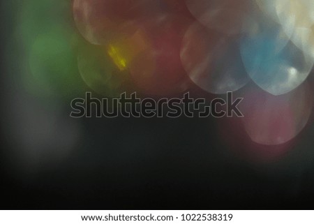 lens flare. colorful abstract. bokeh light on black background