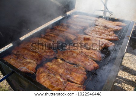 Steaks or meet or pork or beef that are grilled patterns and smoking on the background for design, Fumigated pork