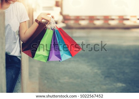 shopping mall. Happy woman holding shopping many color bag enjoying in shopping. Consumerism, shopping, lifestyle concept