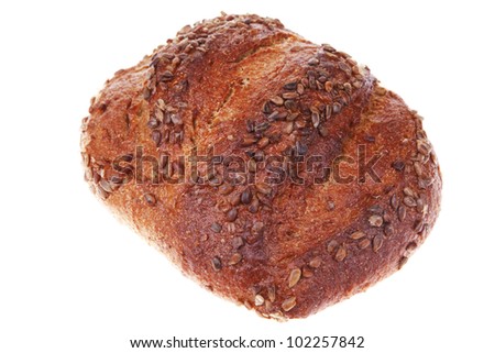 bun of big french rye bread topped with sunflower seeds isolated over white background