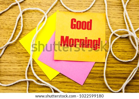Good Morning. word on yellow sticky note in wooden background. Bussines concept. Motivational.