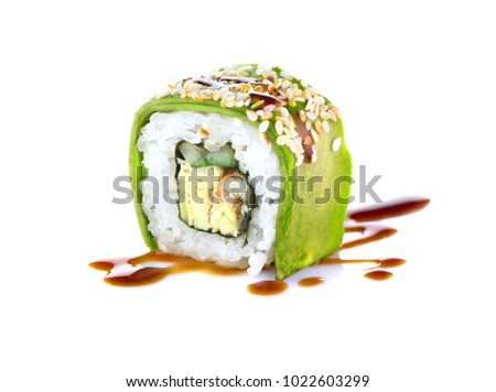 Sushi roll japanese food isolated on white background. California Sushi roll with vegetables, avocado and unagi sauce closeup. Japan restaurant menu.