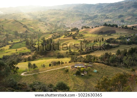 Sunset over landscape in a valley: Colombia Royalty-Free Stock Photo #1022630365